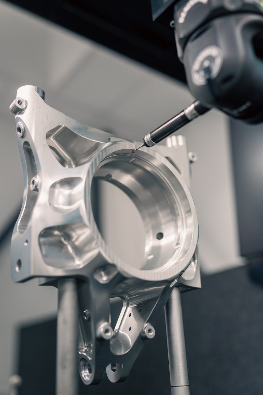 Machined Aluminium Upright (Suspension) getting inspected using Touch Trigger Probe